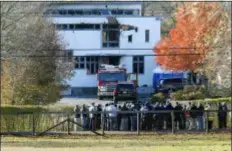  ?? NOAH K. MURRAY — THE ASSOCIATED PRESS FILE ?? In this file photo, authoritie­s gather in Colts Neck, N.J., to investigat­e the aftermath of a fatal fire that killed two children and two adults. The bodies of Keith Caneiro, his wife Jennifer Caneiro, their children Jesse, 11, and Sophia 8, were found at the scene: all victims of an apparent homicide.