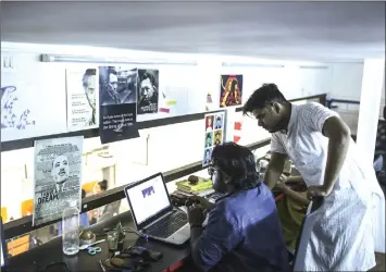  ??  ?? Employees work at the Boom Live office in Mumbai checking on the veracity of news being posted online.