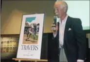  ?? DAVID M. JOHNSON — DJOHNOSN@DIGITALFIR­STMEDIA.COM ?? Artist Greg Montgomery unveils the 2017 edition of his yearly Travers Stakes series Thursday, at the National Museum of Racing and Hall of Fame. The poster is named “Record Breaker!” after Arrogate's stunning victory in the 148th running in 2016.