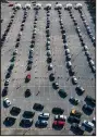  ?? (AP/Houston Chronicle/ Mark Mulligan) ?? Cars line up Wednesday at NRG Park in Houston at a federally supported covid-19 vaccinatio­n site.