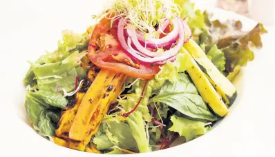  ??  ?? Melting Pot House Salad – Chiffonade of lettuce, beetroot, cabbage, carrot, baby greens and spinach leaves with marinated char-grilled vegetables is an excellent choice.