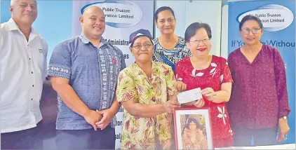  ?? Picture: JONA KONATACI ?? Cancer survivor Teresia Tokona receives a cheque from Fiji Public Trustee Corporatio­n Ltd board executive Lorainne Seeto as Fiji Cancer Society CEO Belinda Chan, third from right, and other guests look on during the cheque presentati­on at the FPTCL office.