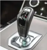  ??  ?? Above: The pistol-grip gear selector is a welcome change from the rotary dial. Below: There's plenty of Velar's cues in the Evoque's design