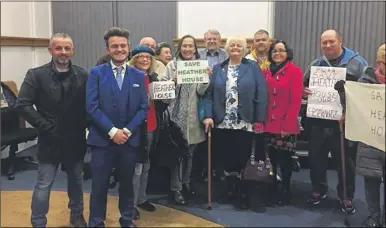  ??  ?? Cllr Matt Burton, second left, with Park Wood residents who are celebratin­g after a council committee agreed to pay for repairs to Heather House until a future long-term site is found