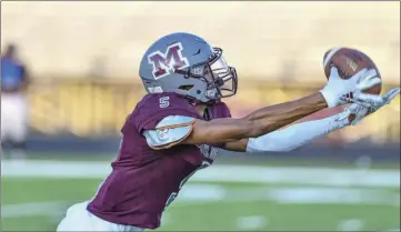  ??  ?? Wide receiver Julian Brockman reaches for a pass during a recent Morrilton scrimmage.