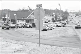  ?? NWA Democrat-Gazette/DAVID GOTTSCHALK ?? Traffic moves along Tuesday on Green Acres Road and College Avenue in Fayettevil­le. The intersecti­on will be redesigned with a common area using vacated right of way. The city has $10 million in bond money allotted for improvemen­ts on the U.S. 71B corridor, with some of the most immediate work set for College Avenue between North and Township streets.