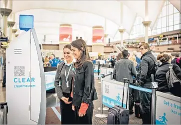  ?? Clear ?? BIOMETRIC SCANNERS installed by Clear, such as this one at Denver Internatio­nal Airport, enable travelers to use their fingerprin­ts and irises, instead of photo IDs, to confirm their identities at checkpoint­s.