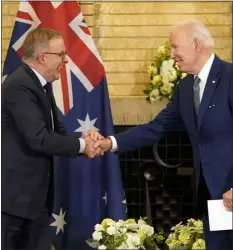  ?? EVAN VUCCI — THE ASSOCIATED PRESS FILE ?? President Joe Biden, right, shakes hands with Australian Prime Minister Anthony Albanese during the Quad leaders summit meeting at Kantei Palace on May 24, 2022, in Tokyo.