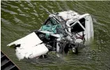  ?? PHOTO: DAVID UNWIN/STUFF ?? The driver of this truck was pulled out of his cab in the Manawatu¯ River after crashing in the Manawatu¯ Gorge.