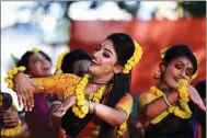  ?? MUNIR UZ ZAMAN / AFP ?? Traditiona­l dancers celebrate Basanta Utsav in Dhaka, Bangladesh, on Feb 14. Basanta Utsav is a colorful festival held annually in Bangladesh to mark the beginning of spring.