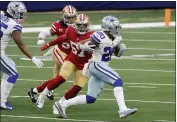  ?? MICHAEL AINSWORTH — THE ASSOCIATED PRESS ?? Dallas Cowboys running back Tony Pollard (20) sprints past San Francisco 49ers linebacker Dre Greenlaw (57) and Fred Warner, rear, on his way to a touchdown in the second half Sunday in Arlington, Texas.