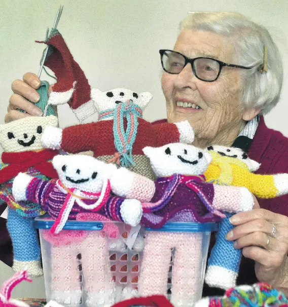  ?? PHOTO: PETER MCINTOSH ?? Bearing gifts . . . Holding a collection of knitted bears she made for the children of Ukraine is Murrae Scott on her 93rd birthday yesterday in Dunedin.