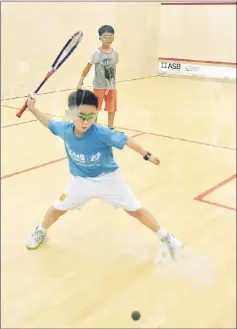  ??  ?? Two participan­ts in action in the Boys U9 preliminar­y round at the Sarawak Squash Centre at Petra Jaya yesterday.