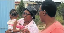  ?? Picture: TSHEPANG EDUCARE TRUST IN BETHLEHEM, EASTERN FREE STATE ?? NOT ENOUGH: A malnourish­ed girl is carried by Limakatso Selisa, with Vivian Mothijoa in tow. This child cannot access the grant because her mother has no ID