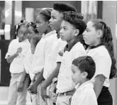  ?? JOE BURBANK/ORLANDO SENTINEL ?? Students listen to The Children's Trust of Orange County Chairman Dick Batchelor deliver remarks during a press conference at the Walt Disney World Boys and Girls Club in Pine Hills in April.