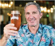  ?? MATIAS J. OCNER mocner@miamiheral­d.com ?? Manny Portuondo, CEO of Cerveceria La Tropical, holds La Tropical’s La Original Amber Lager in Wynwood on Wednesday.