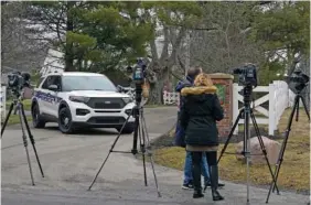  ?? AP PHOTO/MICHAEL CONROY ?? Police secure the entrance to the neighborho­od of former Vice President Mike Pence’s home Friday in Carmel, Ind.