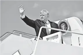  ?? NICHOLAS KAMM, AFP/GETTY IMAGES ?? President Trump boards Air Force One on Friday on his way to his golf course in Bedminster, N.J., for a 17-day vacation. His Twitter account remains just as active.