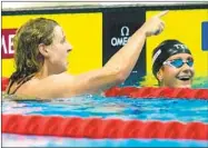  ?? PETR DAVID JOSEK AP ?? Katie Ledecky of the U.S. (left) celebrates with runnerup Katie Grimes after winning 1,500-meter freestyle.