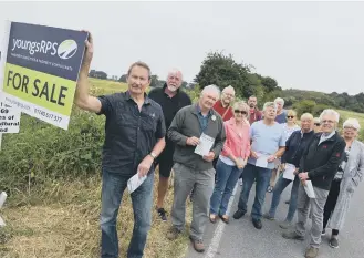  ??  ?? Colin Campbell, front, with Cleadon Village residents on Sunniside Lane.