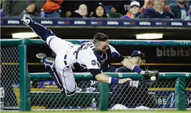  ?? —AFP ?? DETROIT: Catcher James McCann #34 of the Detroit Tigers makes the catch on a foul ball hit by Joey Gallo of the Texas Rangers during the seventh inning at Comerica Park.