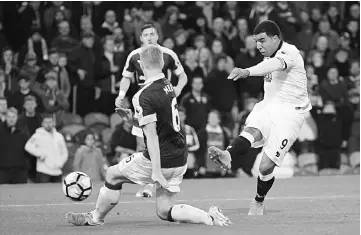  ??  ?? This file photo taken on Sept 26, 2016 shows Watford’s English striker Troy Deeney (right) having a shot that was saved during the English Premier League football match between Burnley and Watford at Turf Moor in Burnley, north west England. — AFP photo