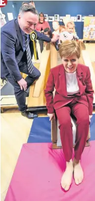  ??  ?? Smooth operator The First Minister tries out the spider slide at Made in Stirling