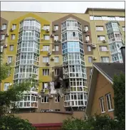  ?? ARA KILANYANTS — FOR THE ASSOCIATED PRESS ?? Broken windows and traces of fire are seen after a drone fell on a residentia­l building in Voronezh, Russia,on Friday.