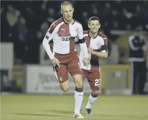  ??  ?? Rangers striker Kenny Miller races away to celebrate his 100th goal for the club, which also turned out to be the winner in Inverness.