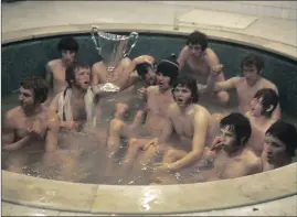  ?? ?? The 1972 heroes celebrate in the bath after winning in the final