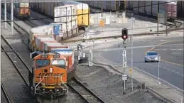  ?? Luis Sinco Los Angeles Times ?? A LOCOMOTIVE hauls cargo from the Port of Long Beach in 2020.
