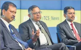  ?? HT/FILE ?? From left: Ajoyendra Mukherjee, global head, HR, TCS; N Chandrasek­aran, chairman, Tata Group and Rajesh Gopinathan, CEO and MD, TCS