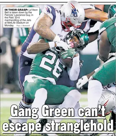  ?? Paul J. Bereswill ?? IN THEIR GRASP: Le’Veon Bell is taken down by the Patriots’ Lawrence Guy, in the Pats’ 33-0 manhandlin­g of the Jets at MetLife Stadium on Monday.