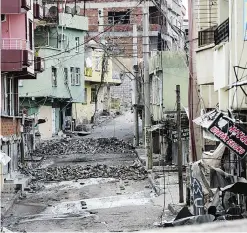  ??  ?? SILVAN: Photo shows a view of a deserted street of Silvan, southern eastern Turkey, during a curfew following clashes between Turkish forces and Kurdish militants. —AFP