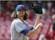  ?? JOHN MINCHILLO — THE ASSOCIATED PRESS ?? New York Mets starting pitcher Jacob deGrom reacts in the first inning against the Cincinnati Reds. deGrom was trying to win his 15th game.