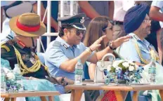  ?? — AFP ?? Captain of IAF Sachin Tendulkar (2L) gestures next to Air Chief Marshal Birender Singh Dhanoa (R) during the 85th Air Force Day parade at Hindon Air Force base in Ghaziabad on Sunday.