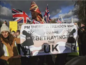  ?? TIM IRELAND / AP ?? People attend the “Brexit Betrayal Rally,” a pro-Brexit rally, Sunday on Park Lane in London. On Tuesday, lawmakers are widely expected to vote down the deal UK Prime Minister Theresa May negotiated with the European Union in Brussels.