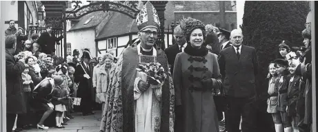  ?? ?? At Easter in 1971 the Queen and the Duke of Edinburgh paid a visit to Tewkesbury. Here the Queen and the Bishop of Gloucester, the Rt Rev Basil Guy, lead a procession into Tewkesbury Abbey