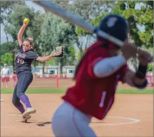  ?? Tom Cruze/For
The Signal ?? Valencia pitcher Shea O’Leary delivers a pitch to Hart batter Brooke Marquez in the first inning of a softball game at Hart. Marquez had three of the Indians’ five hits in the game.