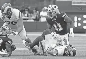  ?? MARCIO JOSE SANCHEZ/AP ?? Rams quarterbac­k Matthew Stafford, bottom, loses the ball after being sacked by Cowboys linebacker Micah Parsons (11).