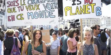  ??  ?? People hold banners as they take part in a march in Marseille, France, as part of a global day of action ‘Rise For Climate’. — AFP photo