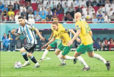  ?? REUTERS ?? Lionel Messi in action with Australia’s Kye Rowles and Aaron Mooy tracking him in the Round of 16 clash on Saturday night.