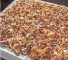  ??  ?? The Made in Oklahoma Coalition’s Nacho Table is ideal for football season.