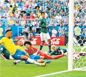  ??  ?? On our way: Neymar slides in the opening goal in Brazil’s last-16 victory