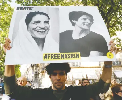  ?? FRANCOIS GUILLOT / AFP VIA GETTY IMAGES FILES ?? People gather outside Iran embassy in France last June to support Iranian human rights lawyer Nasrin Sotoudeh
and demand her release. Sotoudeh has been jailed for defending human rights and political prisoners.