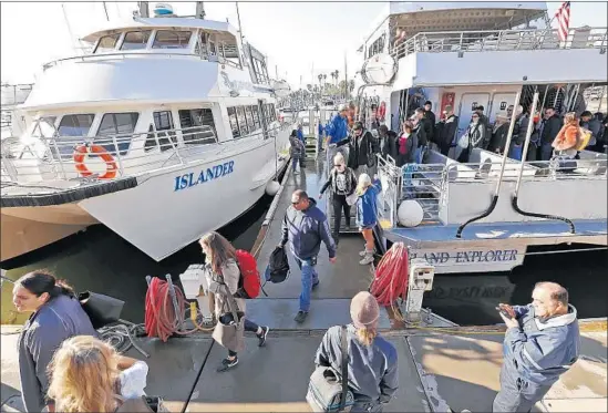  ?? Al Seib Los Angeles Times ?? PASSENGERS ARRIVE in Santa Barbara Harbor from Ventura on ferries offered by local companies as an alternativ­e to the 101 Freeway, buried by mud and debris.