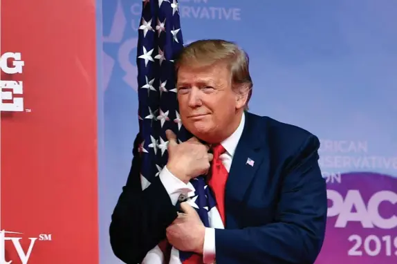  ?? Getty imAgeS File; AP (Below) ?? SHORT BREAK: Former President Donald Trump, seen at the 2019 Conservati­ve Political Action Conference, will be the prime attraction at this weekend’s CPAC event in Florida, where a golden statue of Trump, below, already holds court.