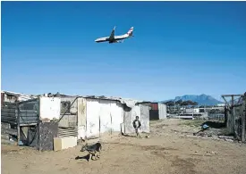  ?? Picture: David Harris ?? People living in the informal settlement of Freedom Farm, near Cape Town Internatio­nal Airport, have to endure the winter cold and damp without basic services.