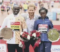  ?? PICTURES: PA ?? 0 Callum Hawkins finished tenth; Prince Harry with men’s and women’s races winners, Kenya’s Eliud Kipchoge and Brigid Kosgei
