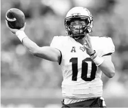  ?? RICH SCHULTZ/ASSOCIATED PRESS ?? Knights QB and Heisman Trophy hopeful McKenzie Milton (10) said freshman backup QB Darriel Mack “is going to be a special player for a long time for UCF.”